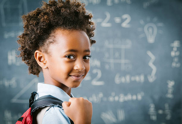 cute little african school girl in classroom.